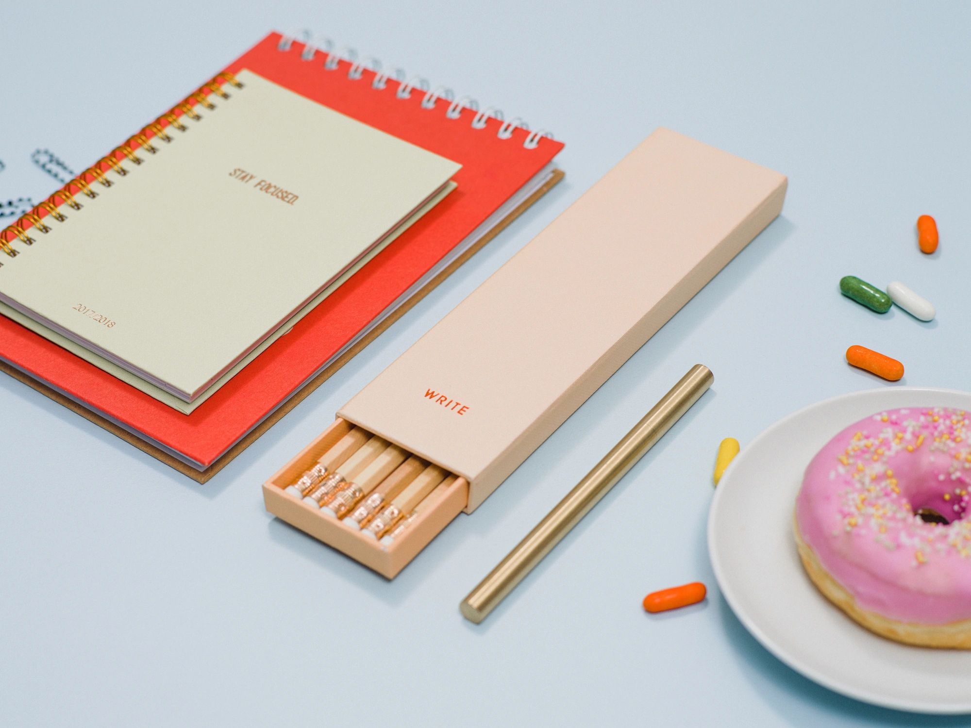 Stationery flat lay with notebook and pencils