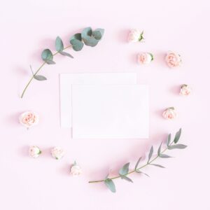 Heartfelt greeting card set styled with blush florals on a soft pink background